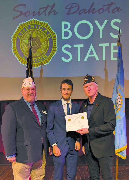 Carter Heckathorn is presented with his certificate recognizing his selection as a South Dakota Boys State Supreme Court justice during the 2025 session. Submitted photo