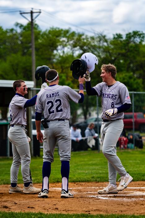 Sterling Schauff, #8 for DV, is congratulated for his home run by teammates, from left Noah Graham and Grady Ramos. Photo by Peterman Sports Photography • stevepeterman5@gmail.com