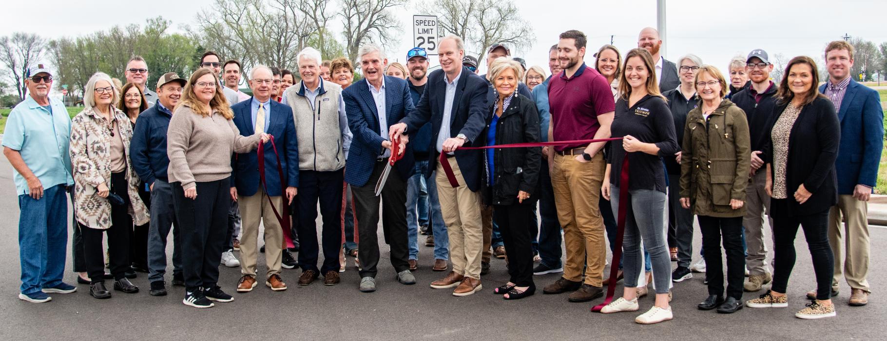 Developers, Elk Point city officials, Chamber of Commerce members and local residents take part in the ribbon‑cutting ceremony for Phase 2 of Country Club Estates on April 23, 2026, on the south end of Pheasant Road in Elk Point. The event marked the launch of the 55‑home expansion led by Elk Point Investments. Photo by Peterman Sports Photography • stevepeterman5@gmail.com