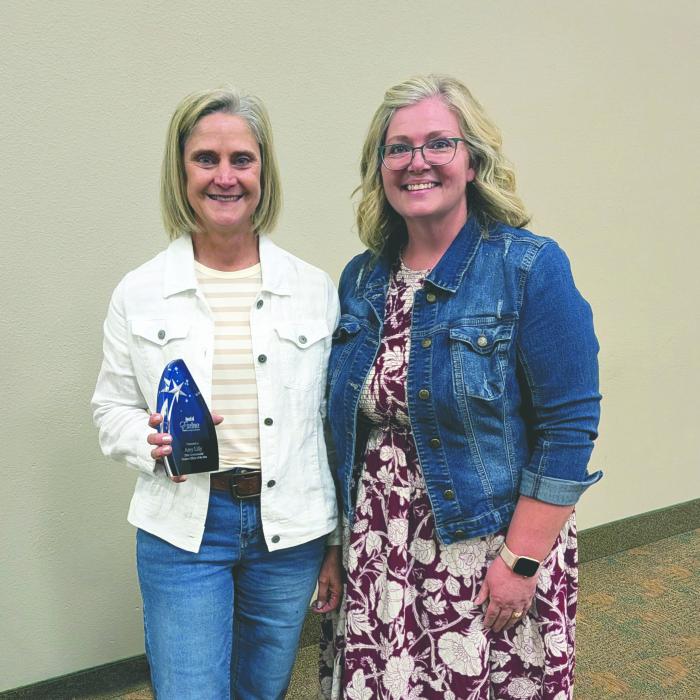 Amy Lilly (left) receives the 2026 Finance Officer of the Year Award from Michelle DeNeui (right), president of the South Dakota Governmental Finance Officers’ Association, during the group’s annual training June 11 in Oacoma, S.D. Submitted photo