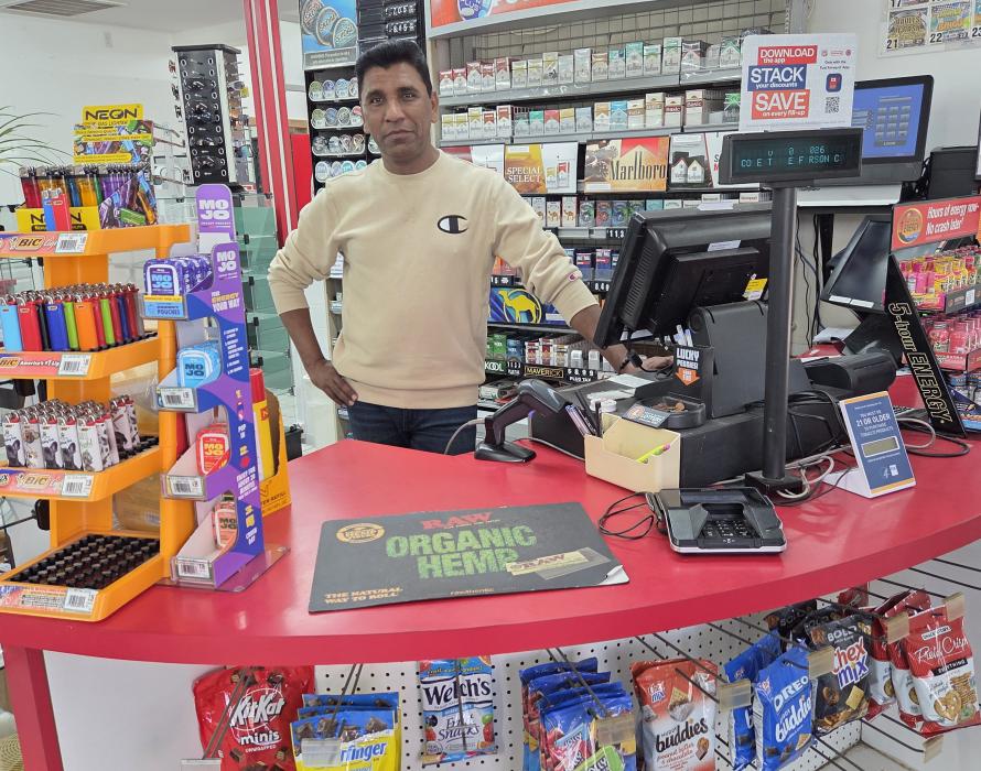 Pit Stop General Manager Haq Bhutta stands behind the main checkout counter at the Jefferson Conoco station on Thursday, Aug. 20, 2026. Under new ownership, the travel plaza has expanded its inventory, extended daily operating hours until 11 p.m. and welcomed Los Concuños Mexican restaurant to the facility. Photo by Shannon Jost • timesleader1@gmail.com