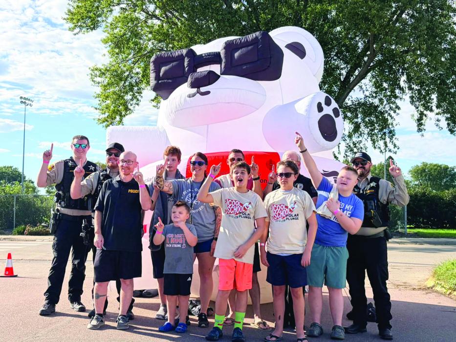 Elk Point Police Chief Jacob Limoges, Elk Point police officers, Union County Sheriff’s Office deputies, Elk Point-Jefferson Special Olympics coach Cassandra Schmith and Polar Plunge participants gather for a group photo during the school’s first Cool School Polar Plunge on Oct. 2 in Elk Point. The event benefited Special Olympics South Dakota. Submitted photo