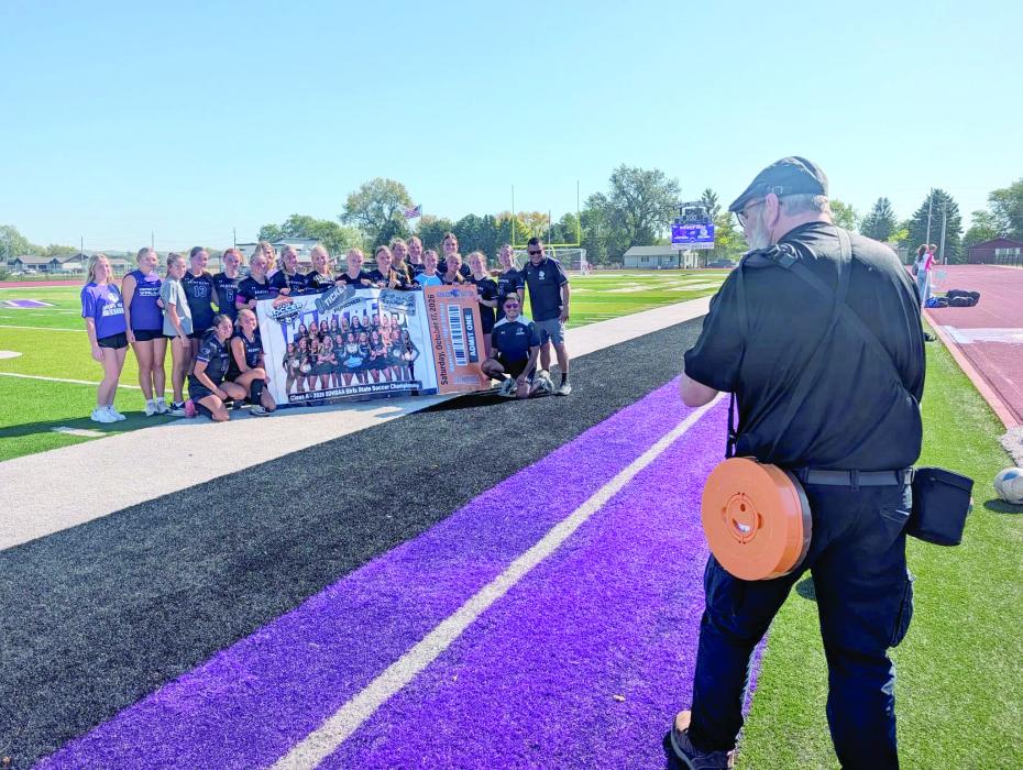 Freelance photographer Steve Peterman, a longtime photography contractor for the Leader-Courier and Dakota Dunes/North Sioux City Times, photographs the 2026 Dakota Valley girls soccer team after the Panthers punched their ticket to the Class A state tournament. Peterman began photography in 1997 and has provided freelance photography since 2002, making him a familiar face along Siouxland sidelines for more than two decades. Photo by Kelly Riibe • times2reporter@gmail.com