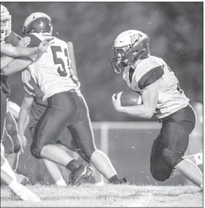 Ben Swatek completes the two-point conversion to end the game Aug. 19 against Parker. Photo by Peterman Sports Photography photoman@iw.net