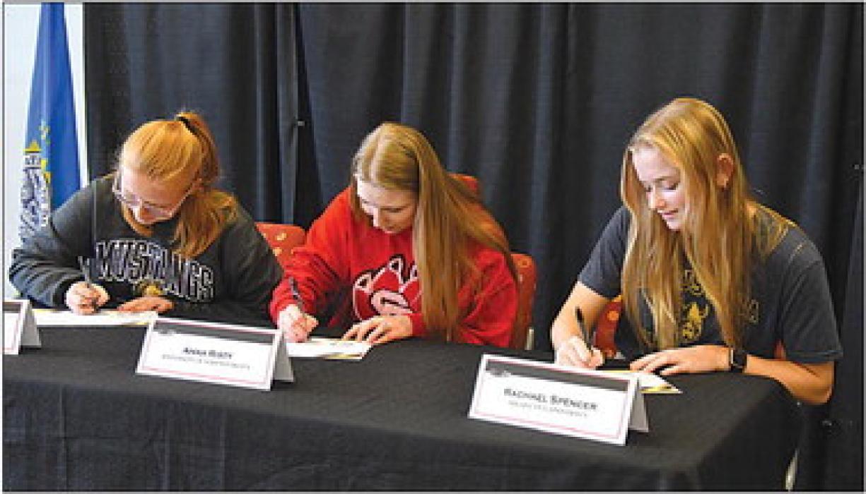 Rachael Spencer (right) signs her Future Teachers Pledge along with Brandon Valley High School classmates in May of 2022. Spencer is now at Augustana University with plans to become an educator for the deaf.