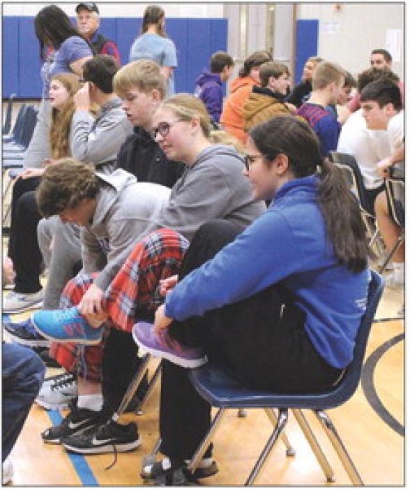 EPJ students try on shoes to make sure they fit. Students pictured are, Courtney Brewer, Izzy Connors, Carter Langle, Thomas Hemmingstad and Samantha Marx. Photo by Beth Sherard-Hutcheson • times1reporter@gmail.com