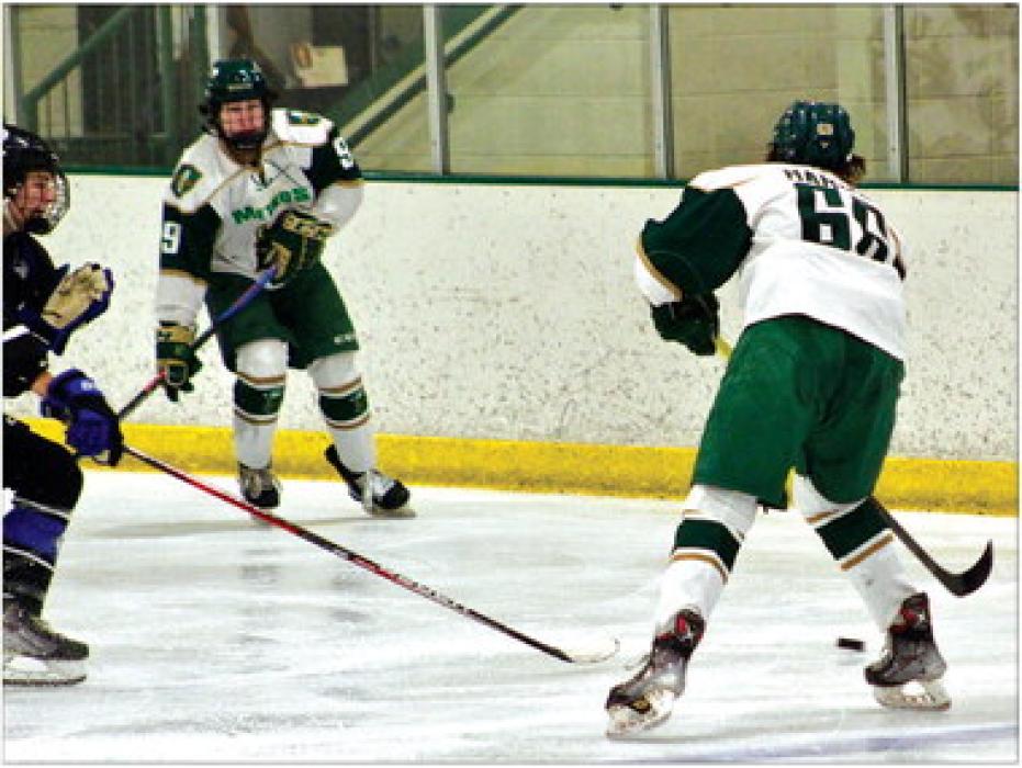 Defenseman Grant Harder passes the puck to Forward Blaze Bauer during Sunday’s matchup with the Lincoln Jr. Stars. Photo courtesy of Brooke Harder