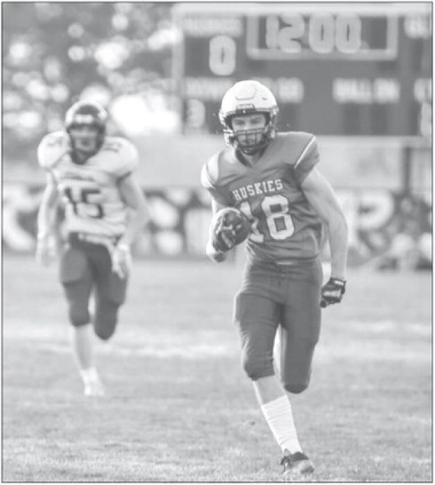 Garrett Merkley was the first Husky to score a touchdown Oct. 20 against Rapid City Christian. He achieved this on the opening kickoff of the game. Photo by Peterman Sports Photography • stevepeterman5@gmail.com