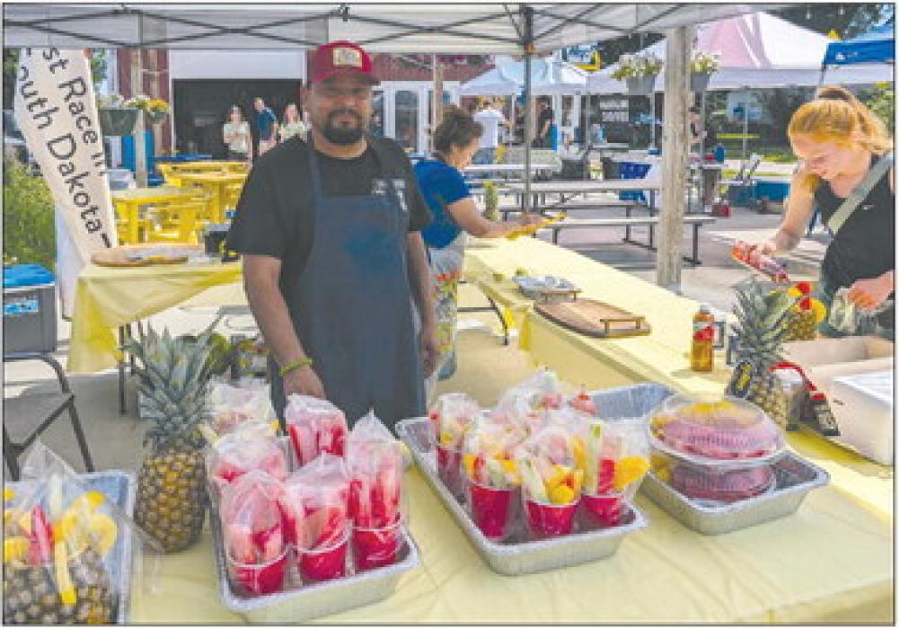 Pedro Tarelo, of Jefferson, had a fun fruit stand set up by Jefferson Beer Supply on Sunday, July 14th. Many people in town for the Jefferson Days of ‘59 car show stopped by to try his fresh cut fruit. Photo by Kelly Riibe • times2reporter@gmail.com