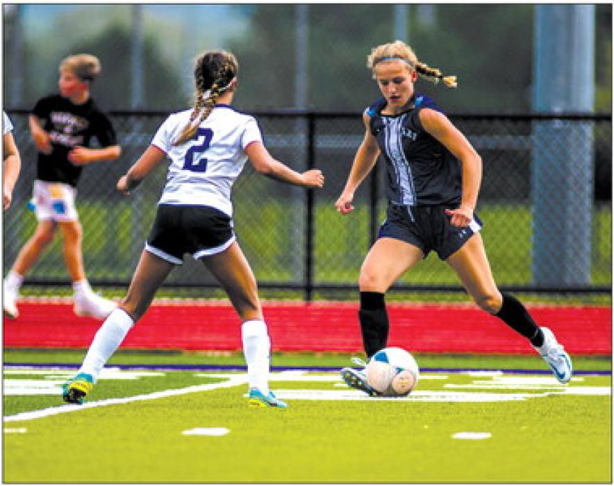 Addy Wubbena makes a move against a Belle Fourche player Aug. 27.  Photo by Peterman Sports Photography • photoman@iw.net