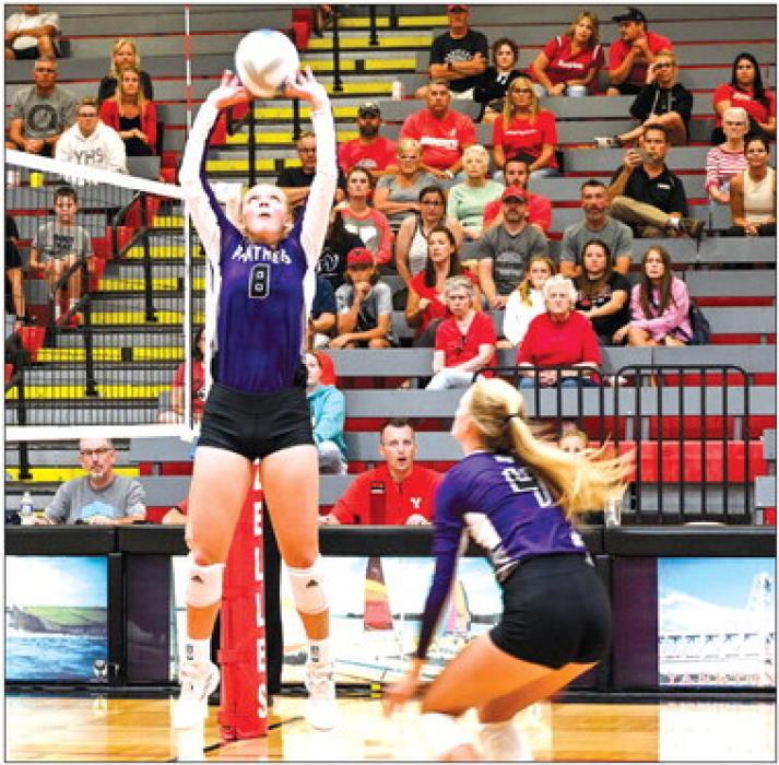 Logan Miller sets the ball to Jorja VanDenHul during the match against Yankton Aug. 25 Photo courtesy of Squier Designs