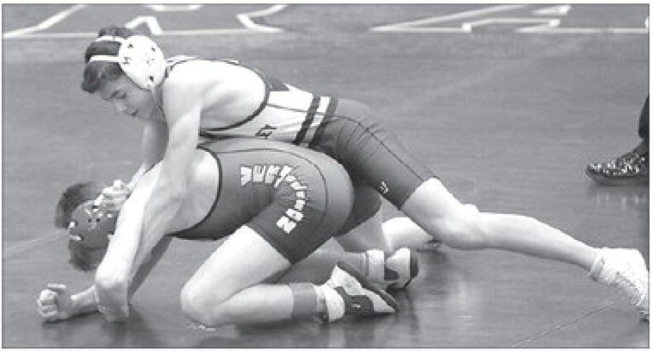 Cameron Curry placed 4th at the SDHSAA Region 2A Wrestling meet held at Brandon Valley Feb. 17. He’s shown wrestling a Vermillion opponent. Submitted photo