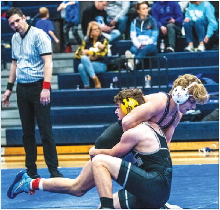 Bennett Lukken wrestles against Tommy Tanner of Hinton, IA Dec. 17 at the Husky Invite. Photo by Peterman Sports Photography • stevepeterman5@gmail.com