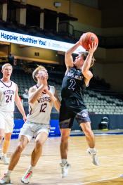Charlie Margeas attacks the basket against Western Christian Dec. 16. He had 8 points, 5 rebounds, 2 assists and 4 steals. Photo by Peterman Sports Photography• stevepeterman5@gmail.com
